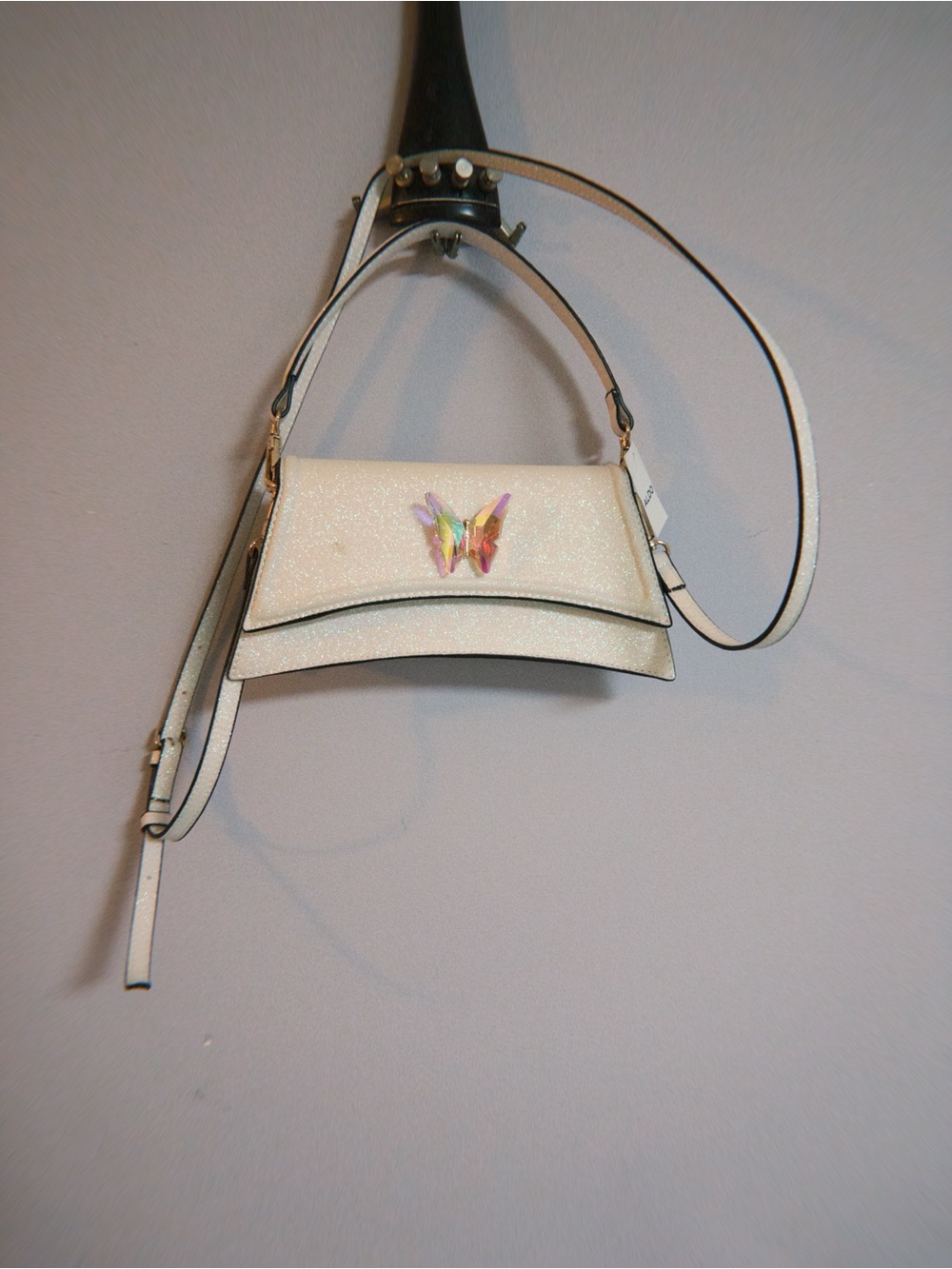 ALDO Akeelax mini bag featuring a sparkling finish and a vibrant iridescent butt